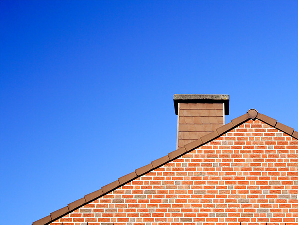 chimney with a blue sky behind it