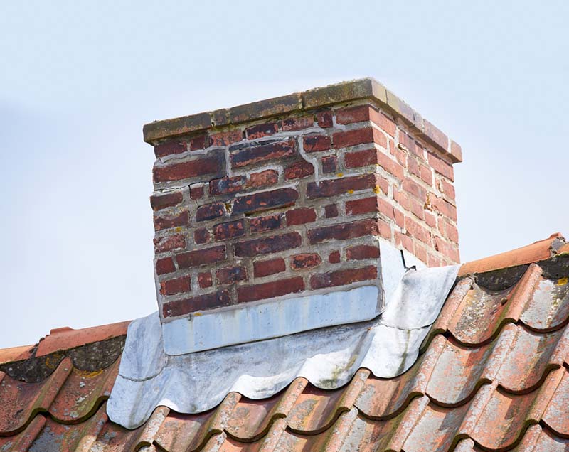 Man inspecting carbon monoxide detector