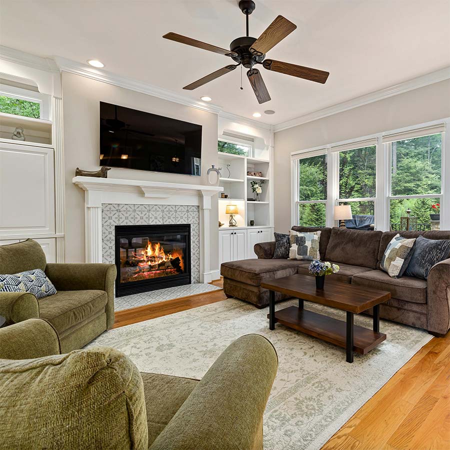 living room with a burning fireplace 