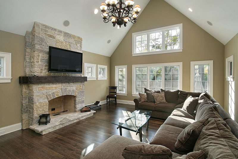living room with stone fireplace 
