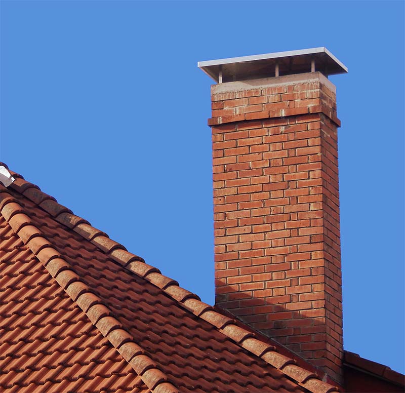 brick chimney with silver chimney cap