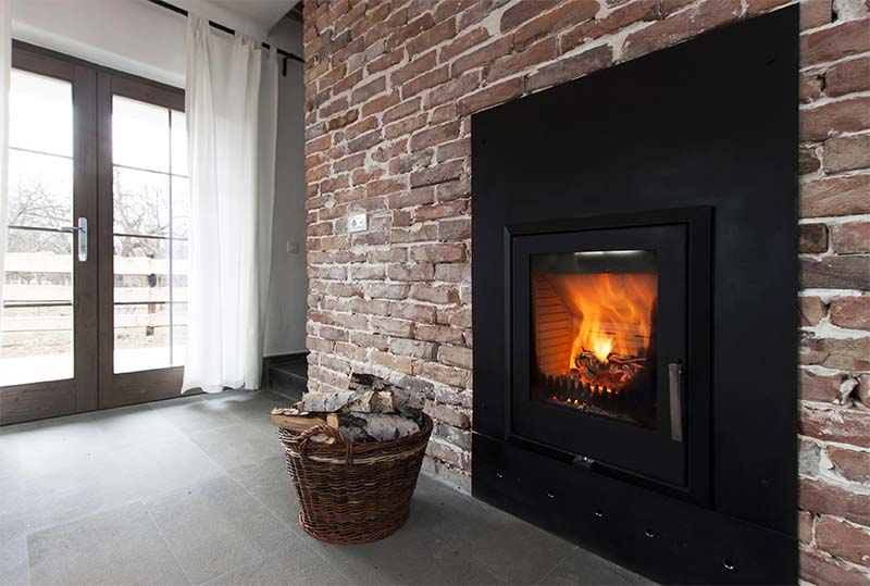 fireplace on a brick wall