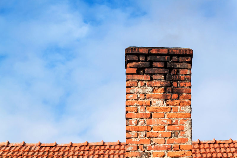 old chimney with cracks and soot